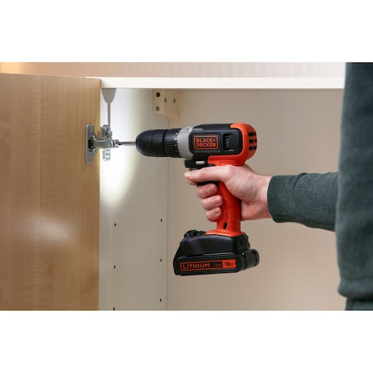 BLACKDECKER cordless drill BCD001C2 with LED light, used to assemble a cabinet. Photo in context.
