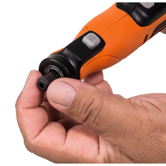 Photo of BLACKDECKER BCRT8I rotary tool being adjusted by hand, close-up, orange and black handle.