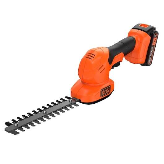 BLACK+DECKER cordless orange and black shrub shear with 18V battery, featuring a compact design and metal cutting blade attachment for garden trimming.