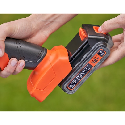 BLACKDECKER BCSS18D1 lithium 18V PowerConnect battery being attached to power tool, close-up.