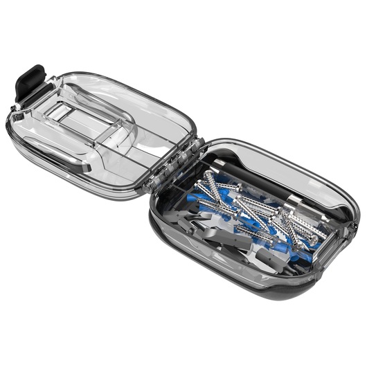 A clear, hard plastic storage case is shown open, containing various metal screws, anchors, and small hardware pieces inside one compartment. The other compartment is empty.