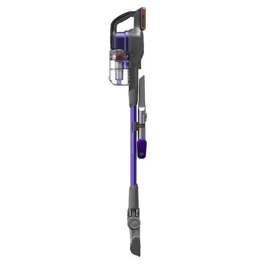 A BLACK+DECKER cordless stick vacuum cleaner with a purple and grey design. The vacuum has a transparent dustbin and attached cleaning accessories, including a brush and crevice tool. It is shown standing upright against a white background.