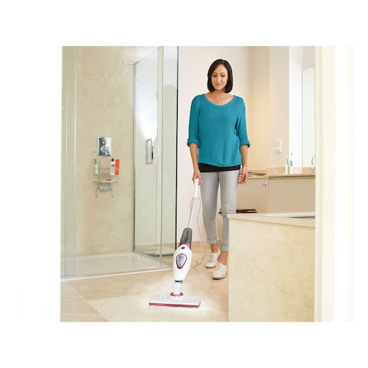 BLACKDECKER BDS1616R steam mop cleaning light tile bathroom floor, person holding handle.
