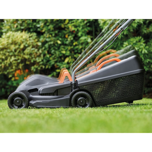 BLACKDECKER BEMW351GL2 lawn mower side view on grass with three handle positions displayed.