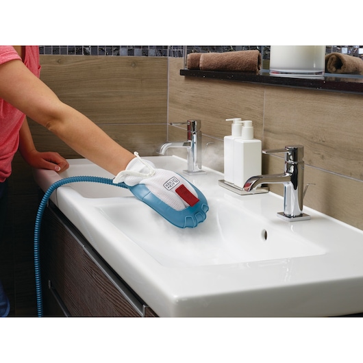 BLACKDECKER BHSM168DSM steam cleaning glove in use on white bathroom sink, flexible blue and white design.