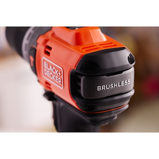 Close-up photo of BLACK+DECKER BLD683XN cordless brushless drill, showing orange and black housing with logo.