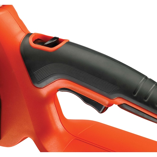 Close-up view of the handle and trigger of an orange and black power tool.