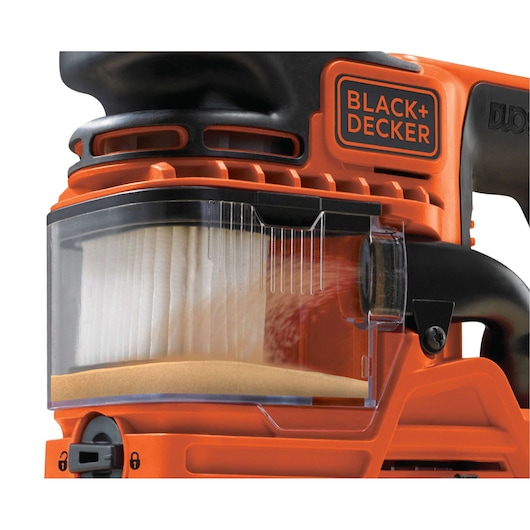 Photo of BLACK+DECKER KA330E sander dust collection box close-up, showing filter and orange body, side angle.