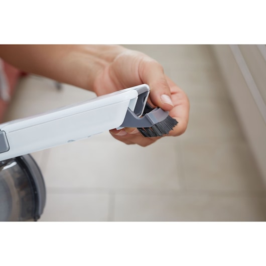 Photo of BLACK+DECKER PV1820L handheld vacuum detailing adjustable brush attachment.